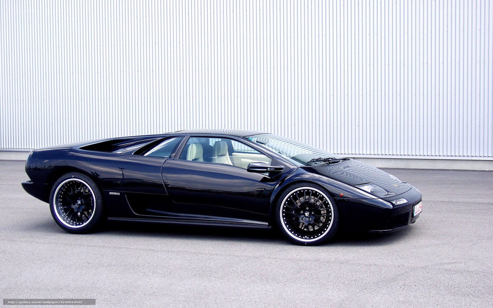 black sports car on pavement