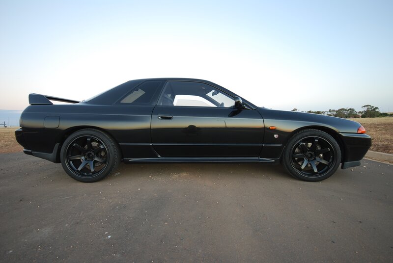 black sports car on pavement