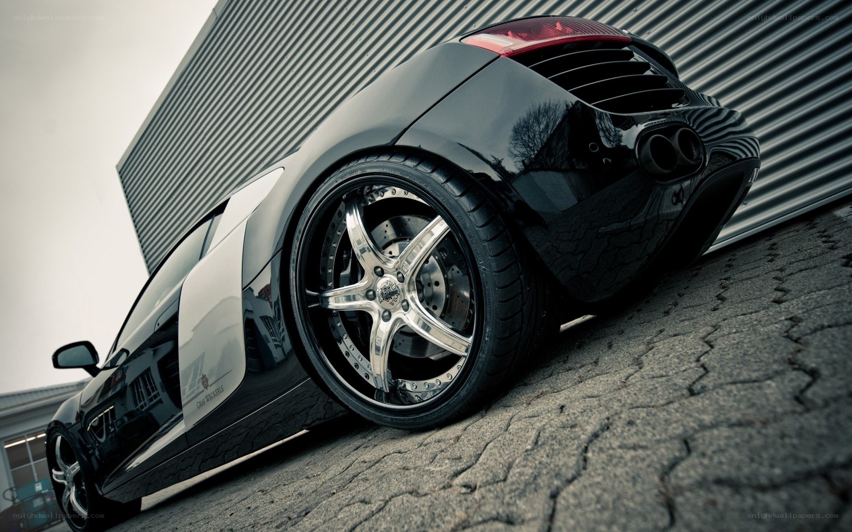 black sports car on pavement