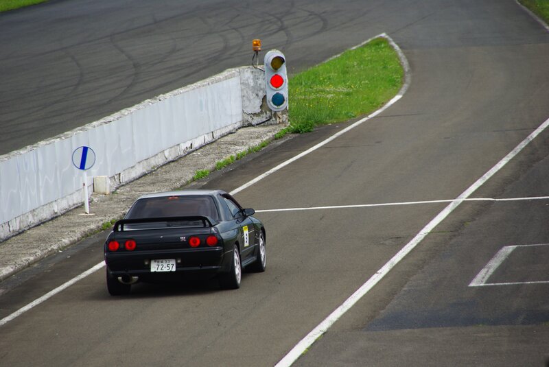 black sports car on racetrack