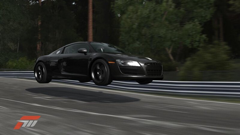 black sports car on racetrack