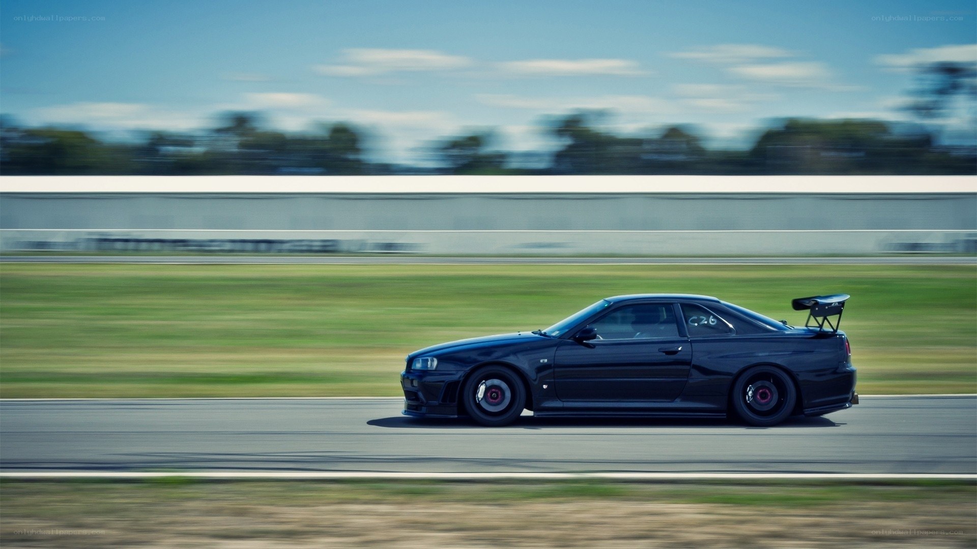 Black sports car on racetrack