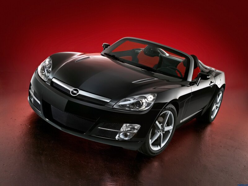 Black sports car on red background