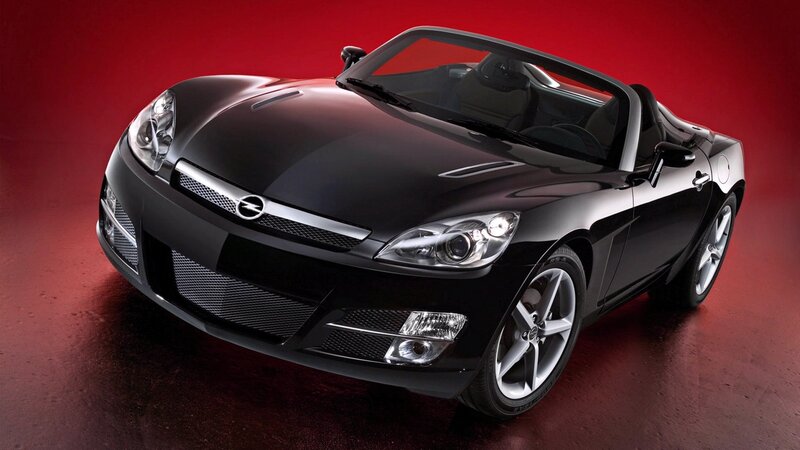 black sports car on red background
