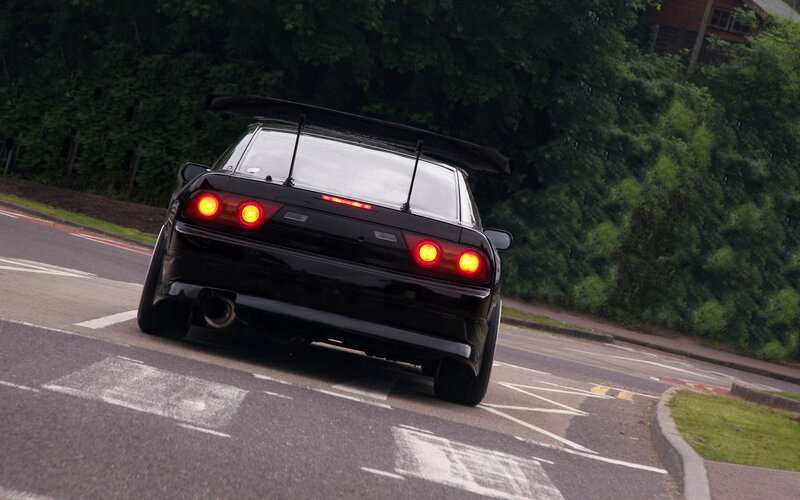 black sports car on road