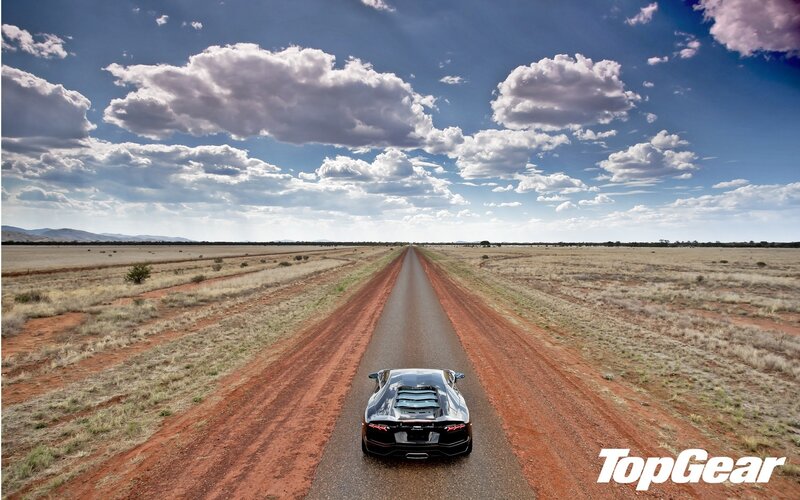 Black Sports Car on Road — Blue, Dramatic, Afternoon, Photograph