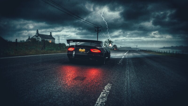 Black Sports Car on Road — Dark Blue