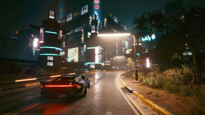 Black Sports Car on Road — Dark, Futuristic