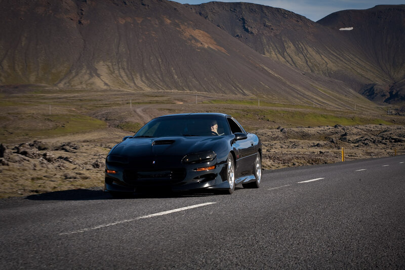 Black Sports Car on Road — Dramatic, Afternoon, Photograph