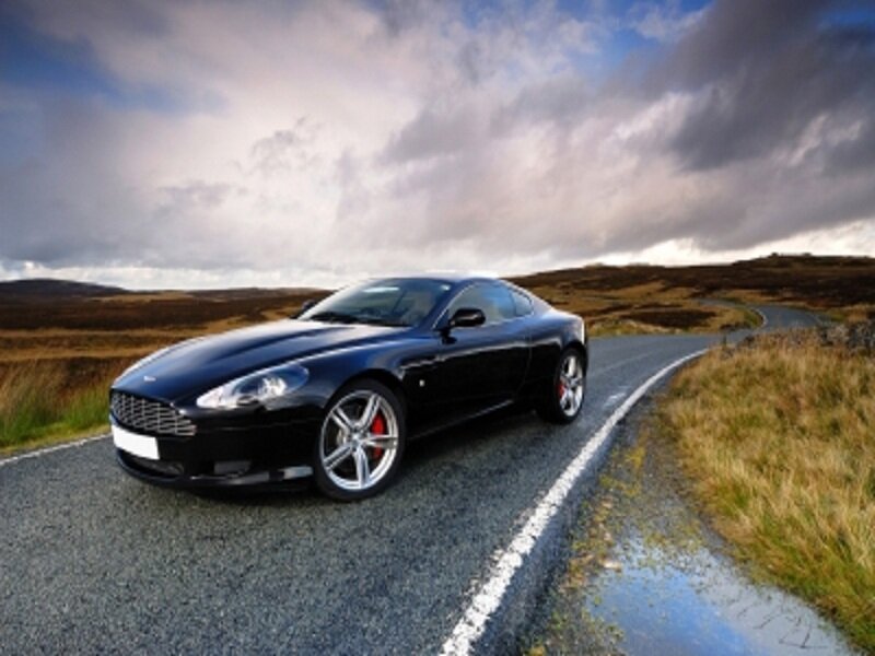 Black Sports Car on Road — Dramatic, Photograph