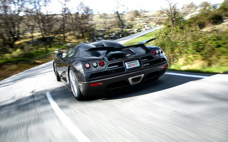 Black Sports Car on Road — Dynamic, Afternoon, Photograph, Trees