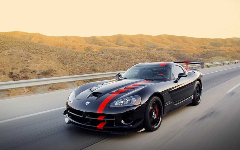 Black Sports Car on Road — Dynamic, Sunset, Photograph, Hills, Guardrail, Red