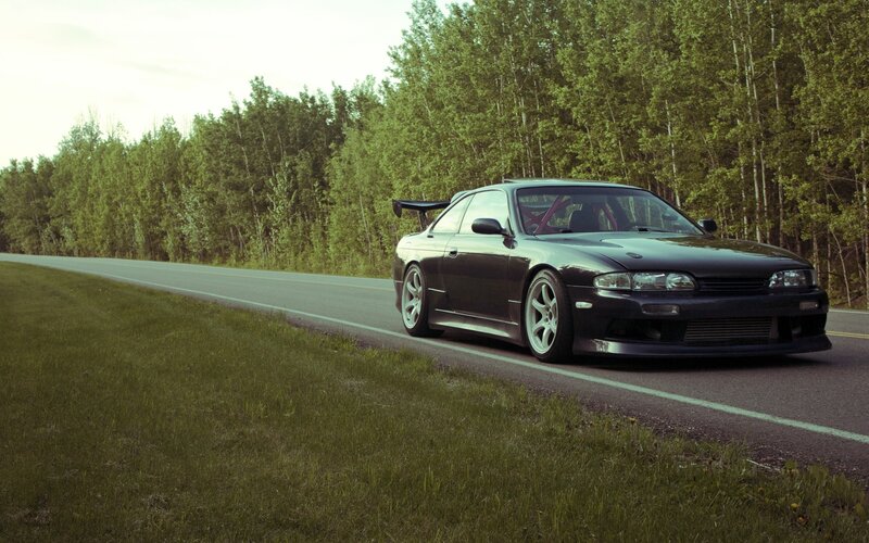 Black Sports Car on Road — Green, Calm, Afternoon