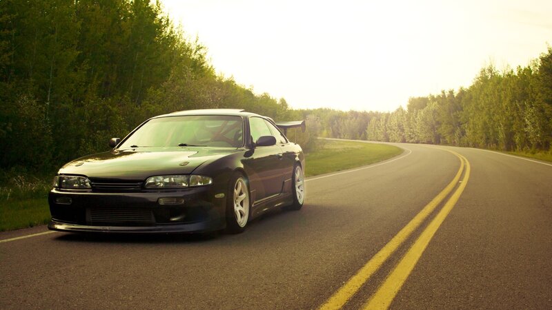 Black Sports Car on Road — Green