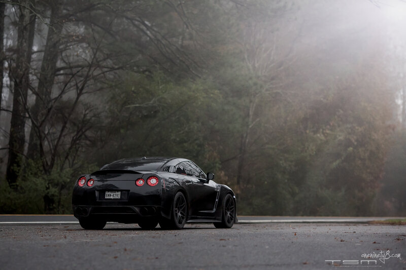 Black Sports Car on Road — Misty
