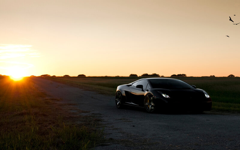 Black Sports Car on Road — Orange