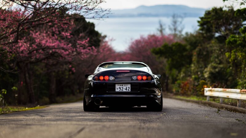 Black Sports Car on Road — Serene, Spring