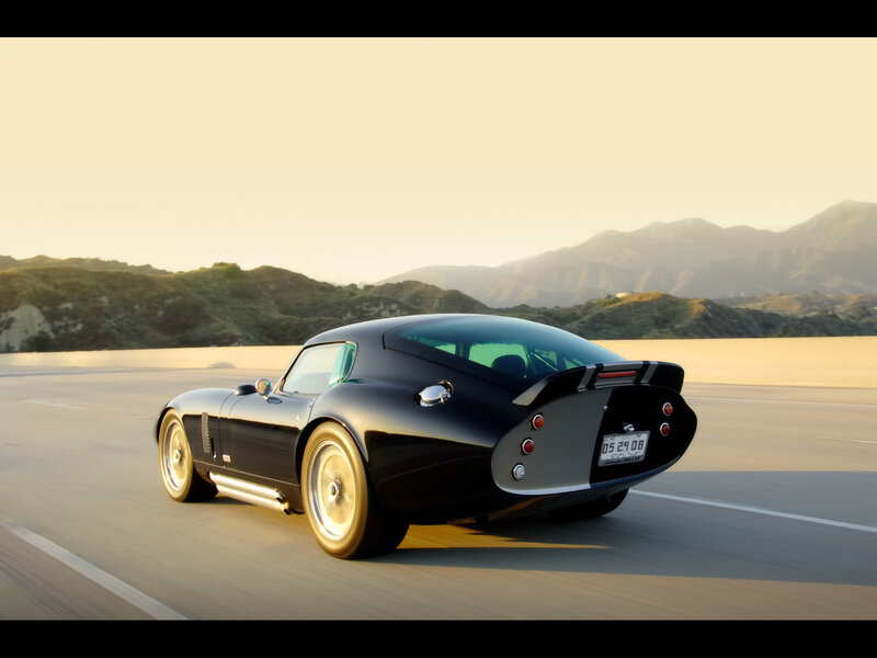 Black Sports Car on Road — Serene