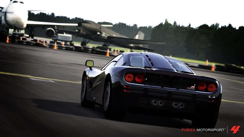 Black Sports Car on Runway — Dynamic