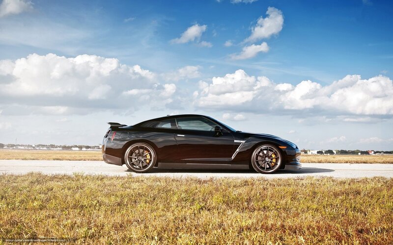 Black sports car on runway