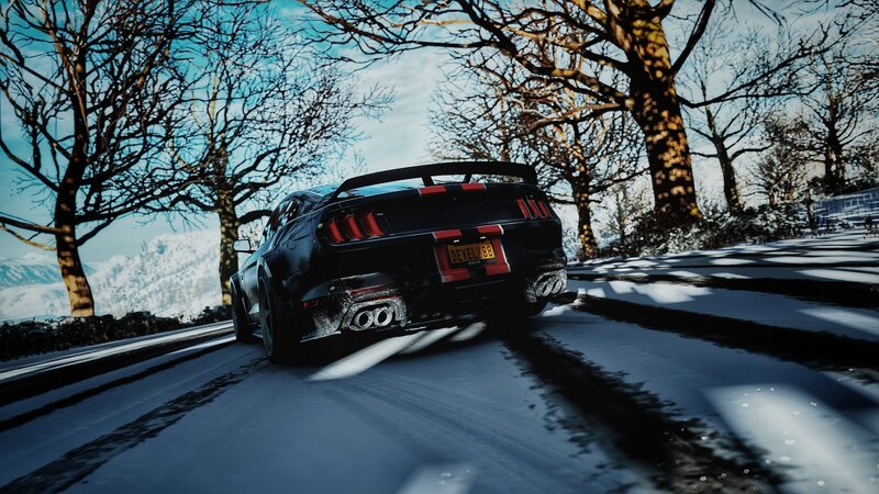 Black Sports Car on Snow — Dramatic, Winter