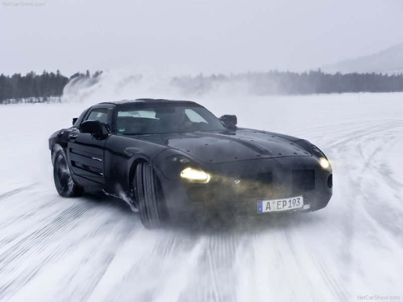 Black sports car on snowy track