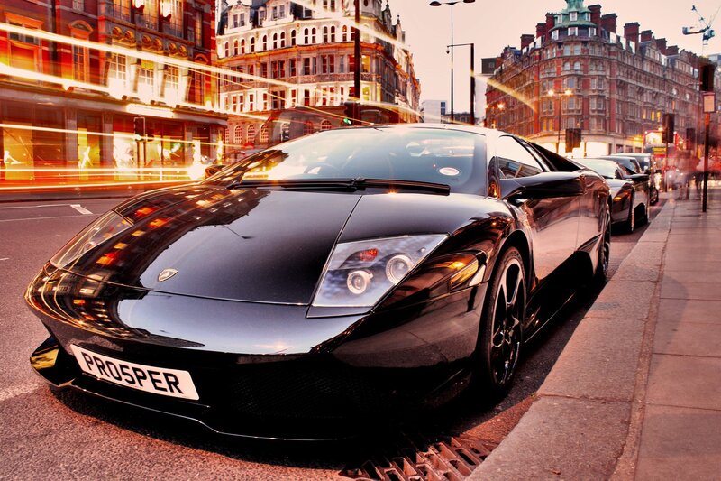 Black Sports Car on Street — Dramatic, Sunset