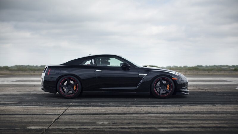 black sports car on tarmac