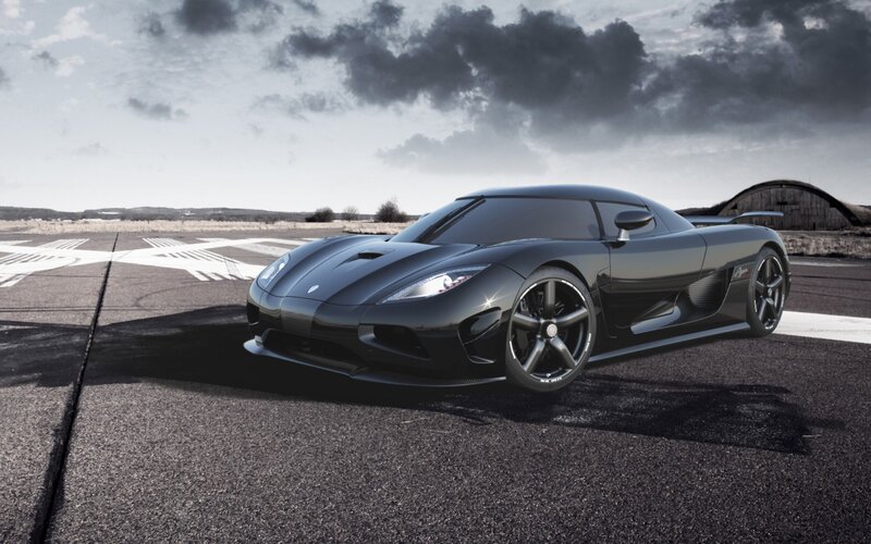 Black Sports Car on Tarmac — Dramatic, Afternoon