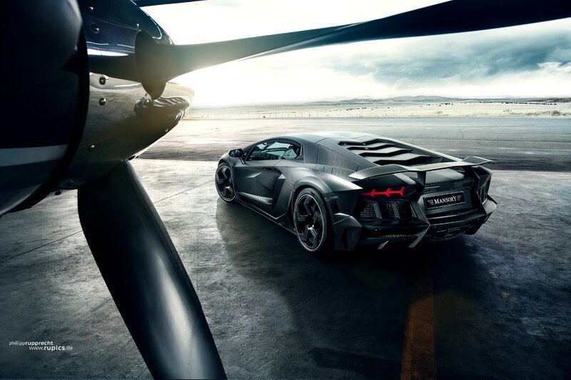 Black Sports Car on Tarmac — Dramatic