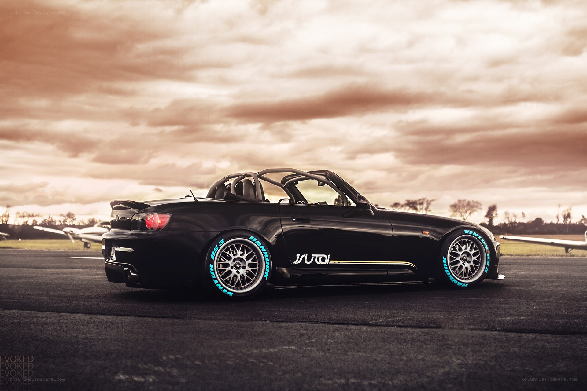 Black sports car on tarmac