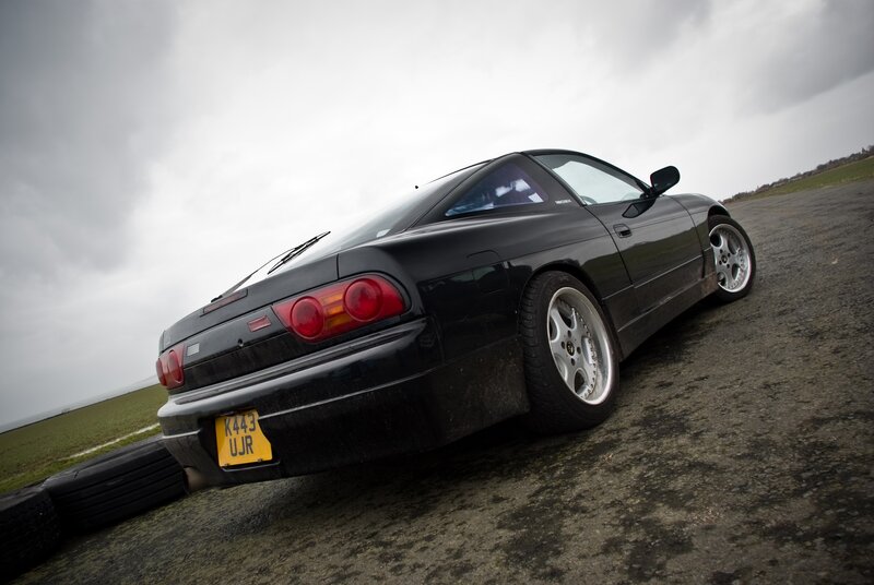black sports car on track