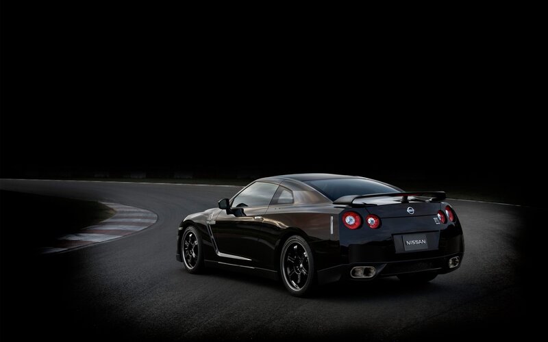 Black Sports Car on Track — Dramatic