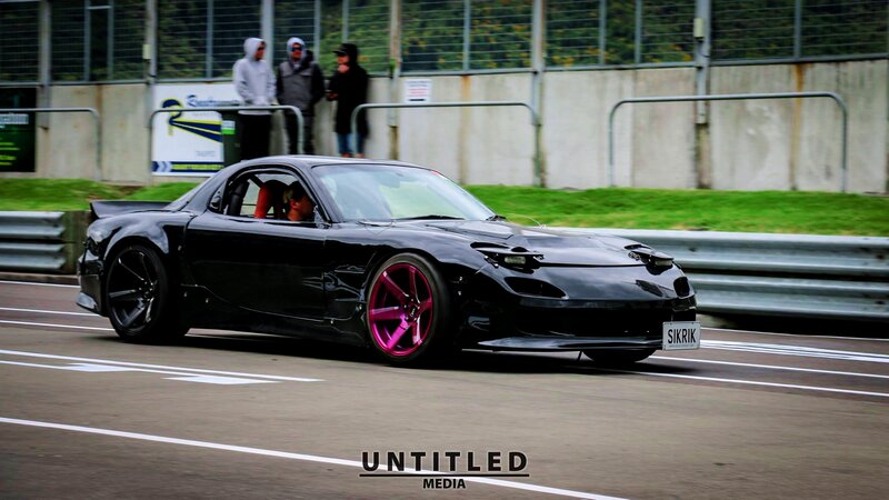 Black Sports Car on Track — Dynamic, Afternoon, Photograph, People