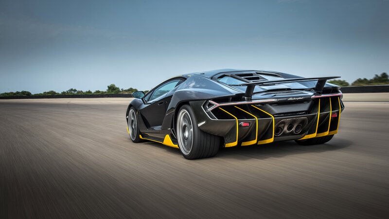 Black Sports Car on Track — Dynamic, Afternoon, Photograph, Race Track, Sky, Trees