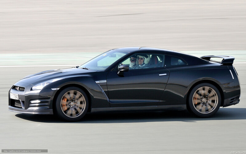Black Sports Car on Track — Dynamic, Afternoon, Photograph, Two People