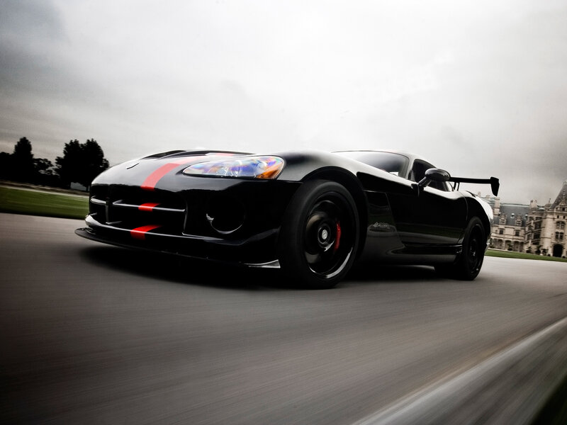 Black Sports Car on Track — Dynamic, Overcast Day