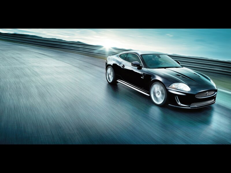 Black Sports Car on Track — Dynamic, Sunset