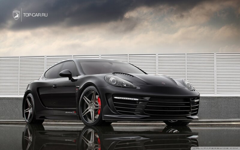 black sports car on wet pavement