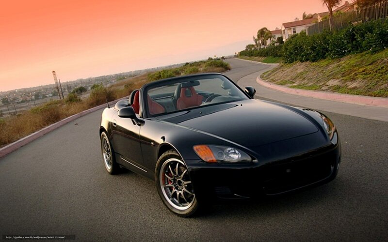 Black sports car on winding road