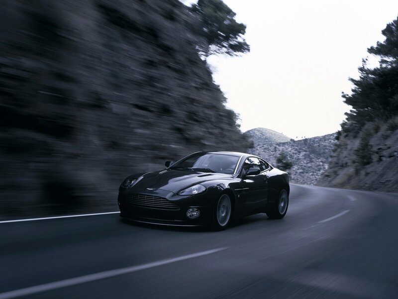 Black sports car on winding road