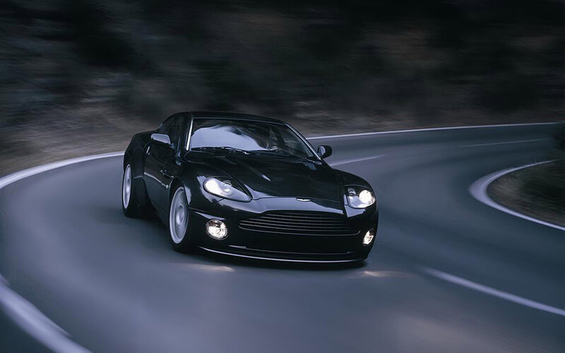 black sports car on winding road