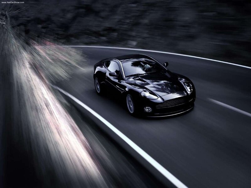 Black sports car on winding road