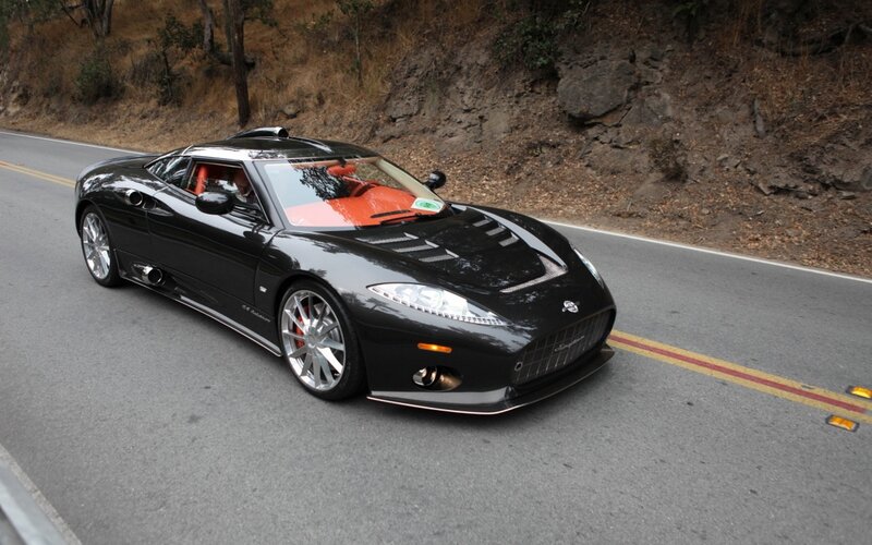 black sports car on winding road