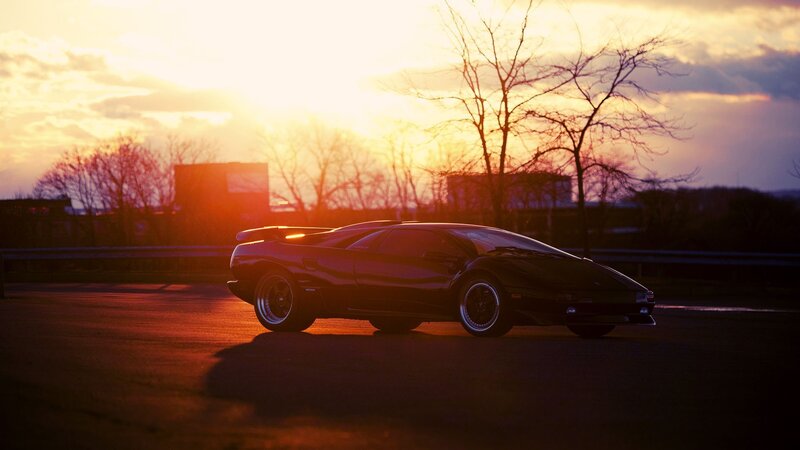 Black Sports Car — Orange, Dramatic, Sunset
