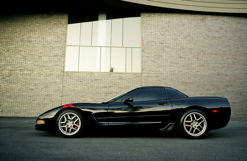 Black sports car parked outside