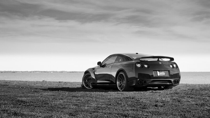 Black Sports Car — Serene, Afternoon, Photograph, Grass