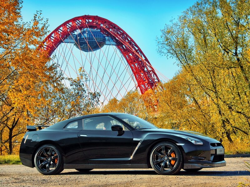 Black Sports Car — Serene, Autumn, Photograph, Red Arch Structure