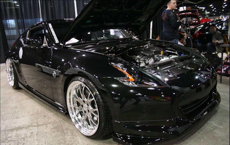Black Sports Car — Showroom, Photograph, Man