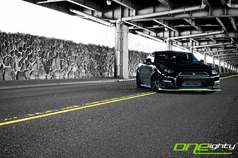 Black sports car under bridge